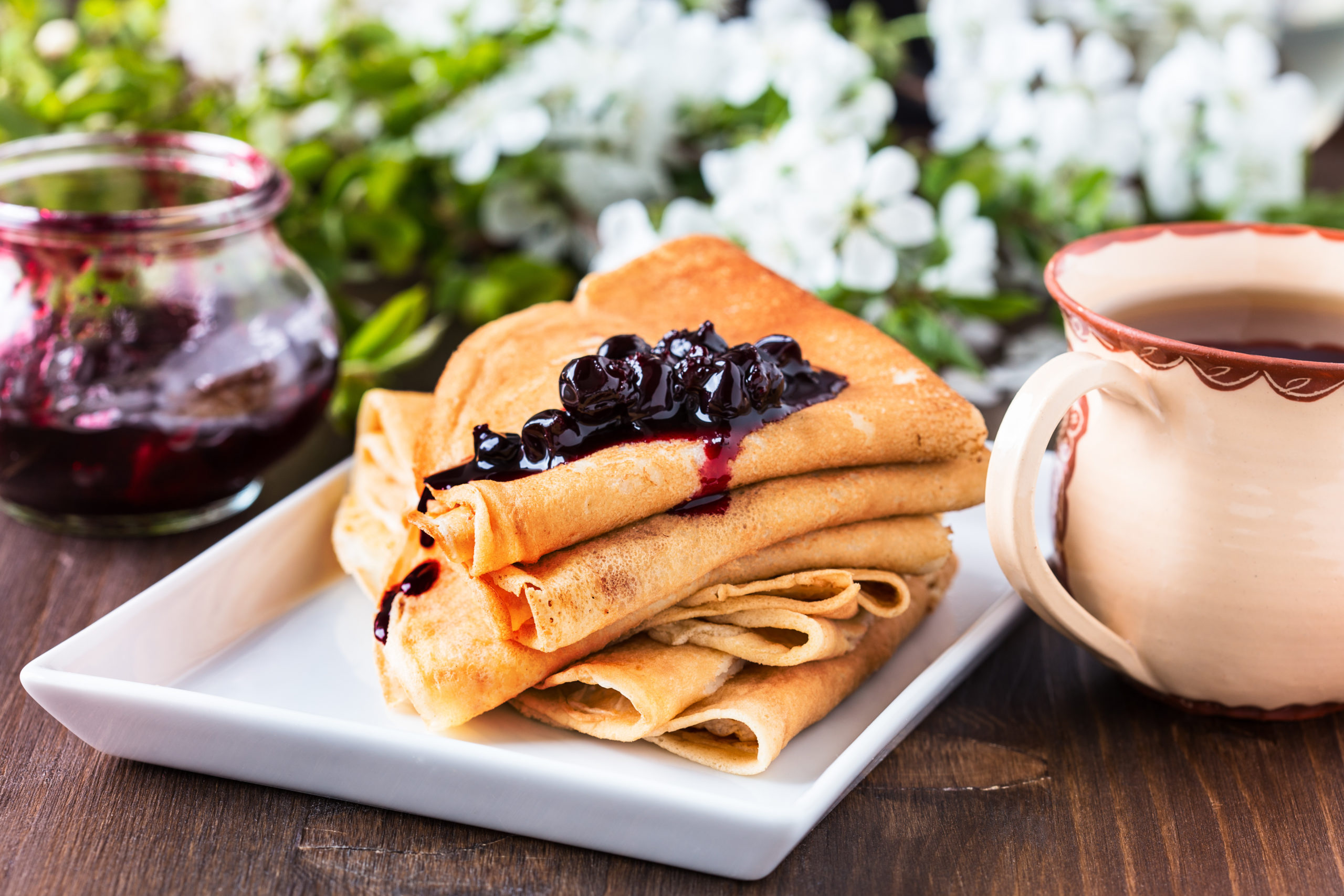 Crepes  folded in triangles with currant jam