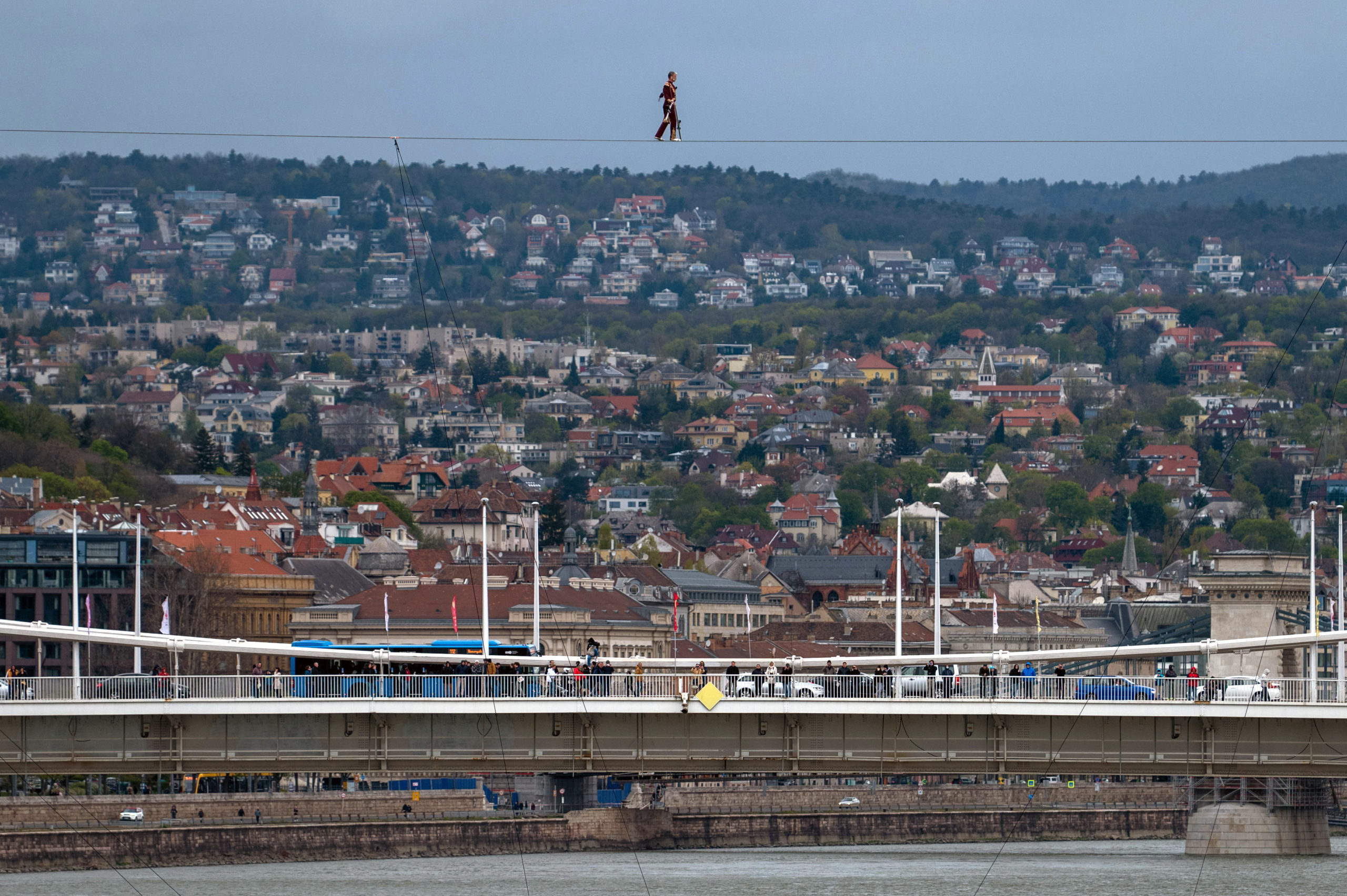 Acrobat Laszlo Simet walks on a wire rope to mark the World Circus Day in Budapest